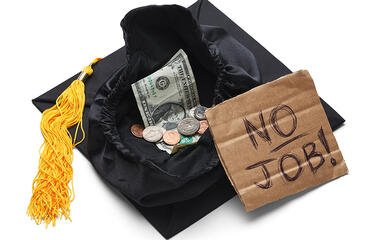 degree cap with sign saying no job